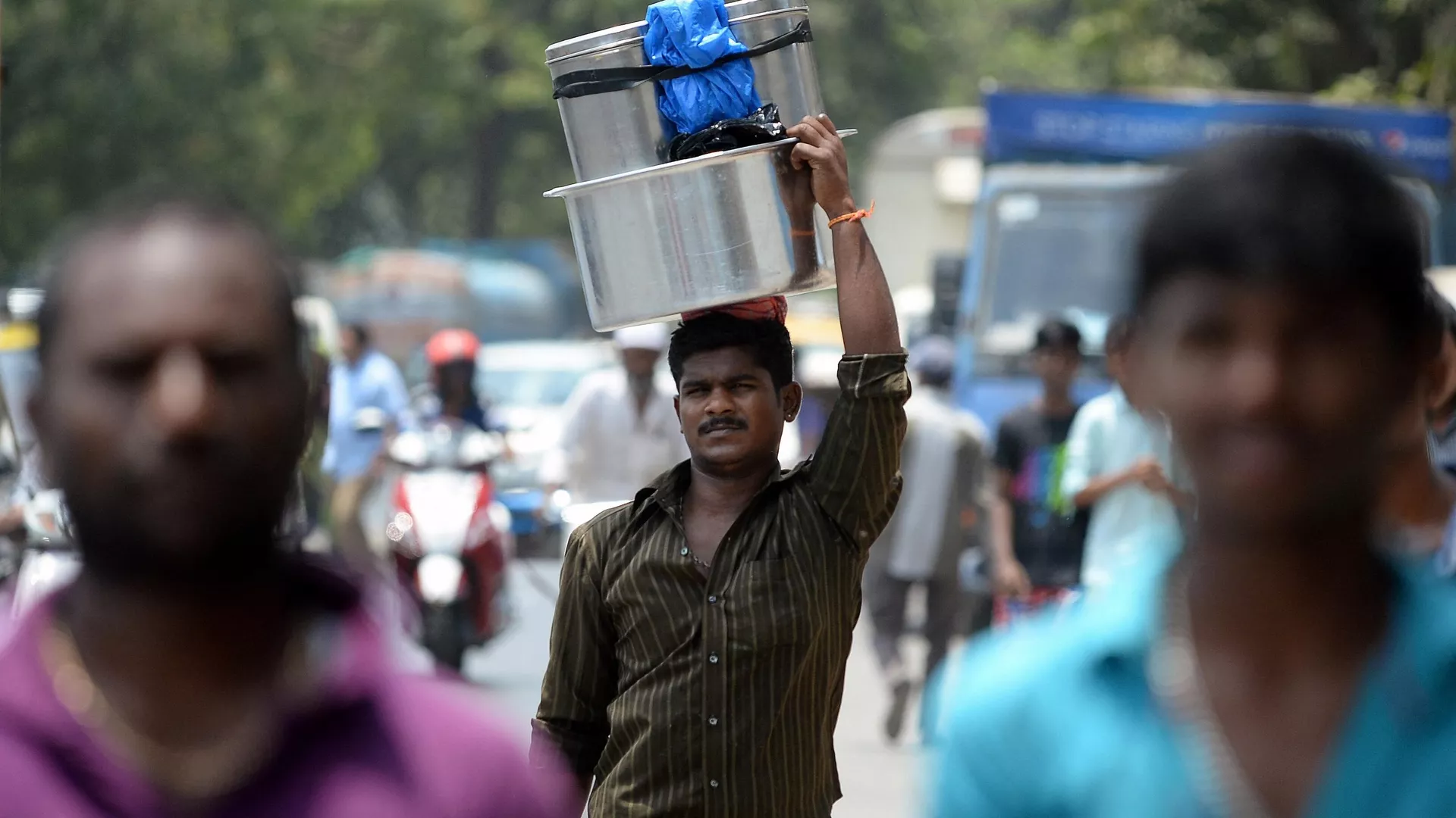 An idli (steamed rice cake) vendor 