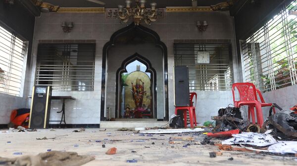 A vandalised temple is seen in Comilla on October 14, 2021, after hundreds vandalised several Hindu temples across the Muslim-majority country following furore over footage of a Koran being placed on the knee of a figure of the Hindu monkey god Hanuman during a religious festival. - Sputnik भारत