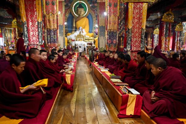 Buddhist monks perform morning prayers at the main Tawang monastery in Tawang, a town in the northeast Indian state of Arunachal Pradesh on April 5, 2023. (Photo by Arun SANKAR / AFP) - Sputnik India