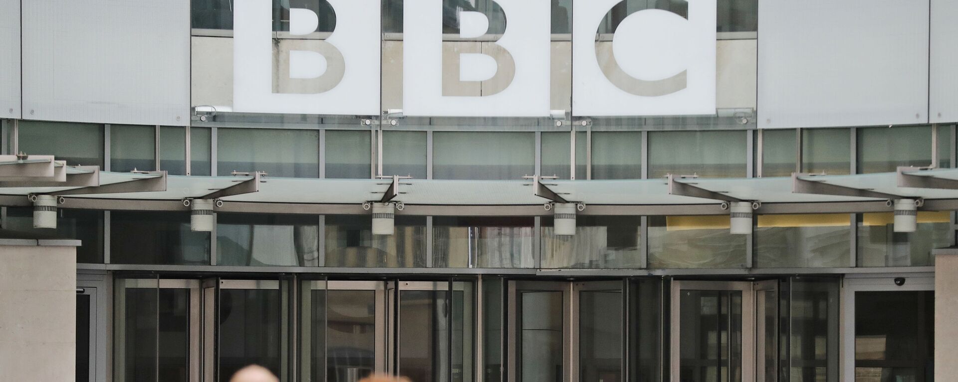 In this file photo dated Wednesday, July 19, 2017, an entrance to the headquarters of the publicly funded BBC in London.  Britain’s government announced Wednesday Feb. 5, 2020, that it is considering a change in the way the nation's public broadcaster, the BBC is funded - Sputnik भारत, 1920, 07.06.2023