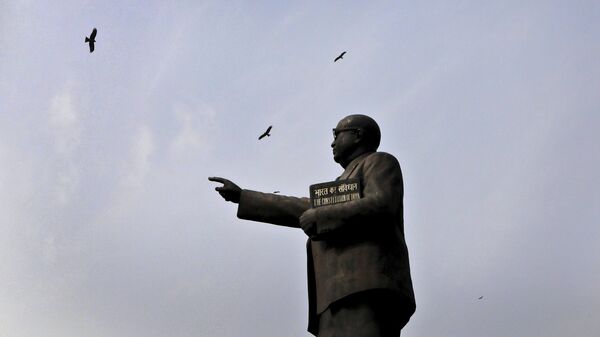 Birds fly over a statue of B.R. Ambedkar, who is also regarded as the architect of the constitution, on Constitution Day at the Parliament House in New Delhi, India, Wednesday, Nov. 26, 2019. - Sputnik India