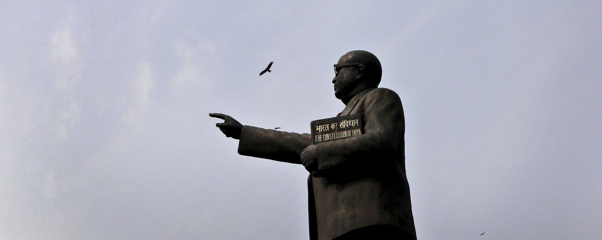 Birds fly over a statue of B.R. Ambedkar, who is also regarded as the architect of the constitution, on Constitution Day at the Parliament House in New Delhi, India, Wednesday, Nov. 26, 2019. - Sputnik India, 1920, 14.04.2023