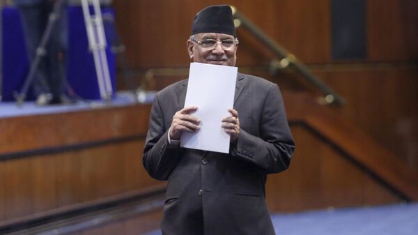 Nepalese Prime Minister Pushpa Kamal Dahal walks to speak before taking the vote of confidence in Nepal's parliament in Kathmandu, Nepal, Monday, March 20, 2023. - Sputnik India