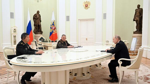 Russian President Vladimir Putin holds a meeting with Chinese Defense Minister Li Shangfu. Russian Defense Minister Sergey Shoigu attended the meeting too. - Sputnik India