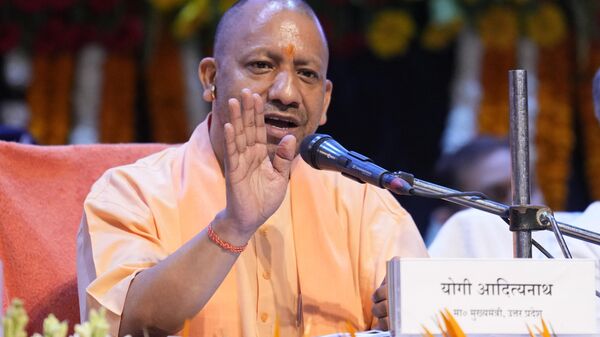 Uttar Pradesh state Chief Minister Yogi Adityanath addresses a press conference on completion of one year of his government's second term in power in Lucknow, in the northern Indian state of Uttar Pradesh , India.  - Sputnik India