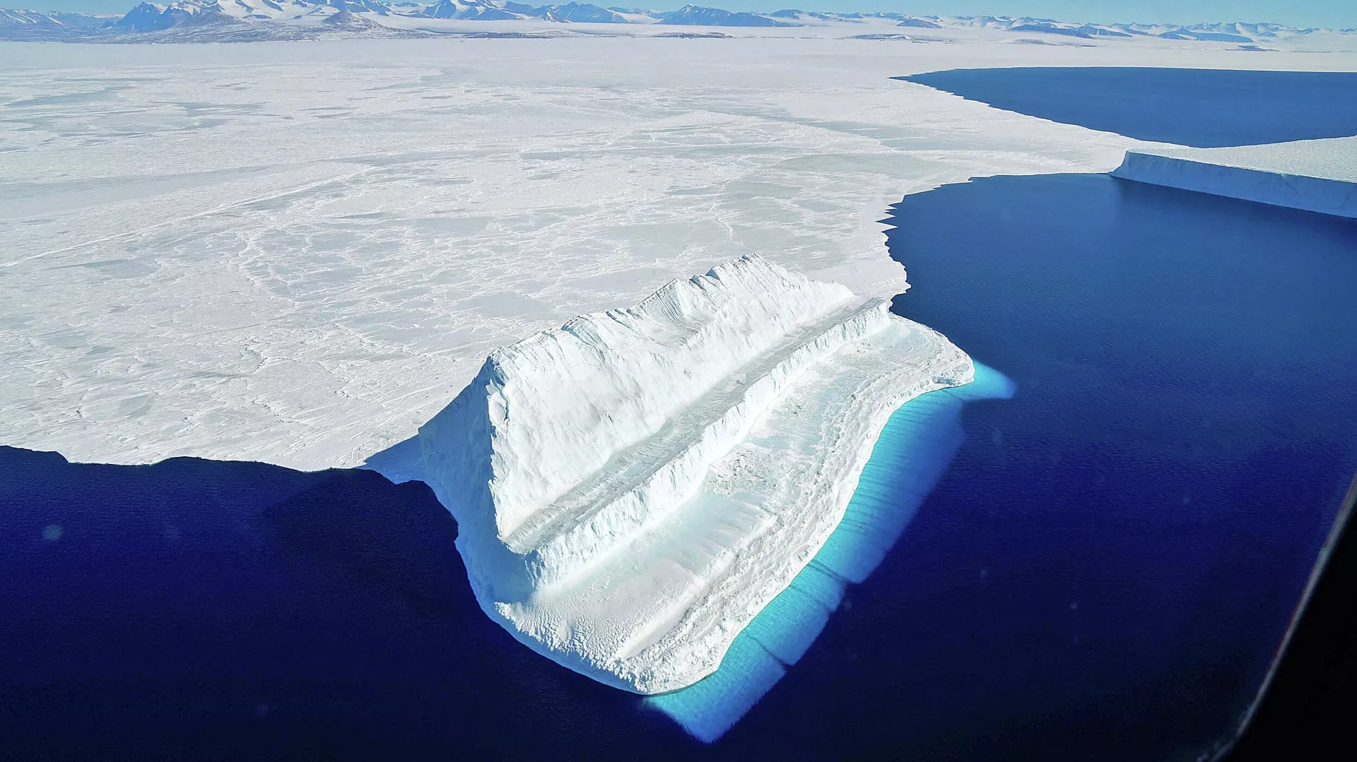 The frigid Antarctic region is an expanse of white ice and blue waters, as pictured in March, 2017, at the U.S. research facility McMurdo Station.