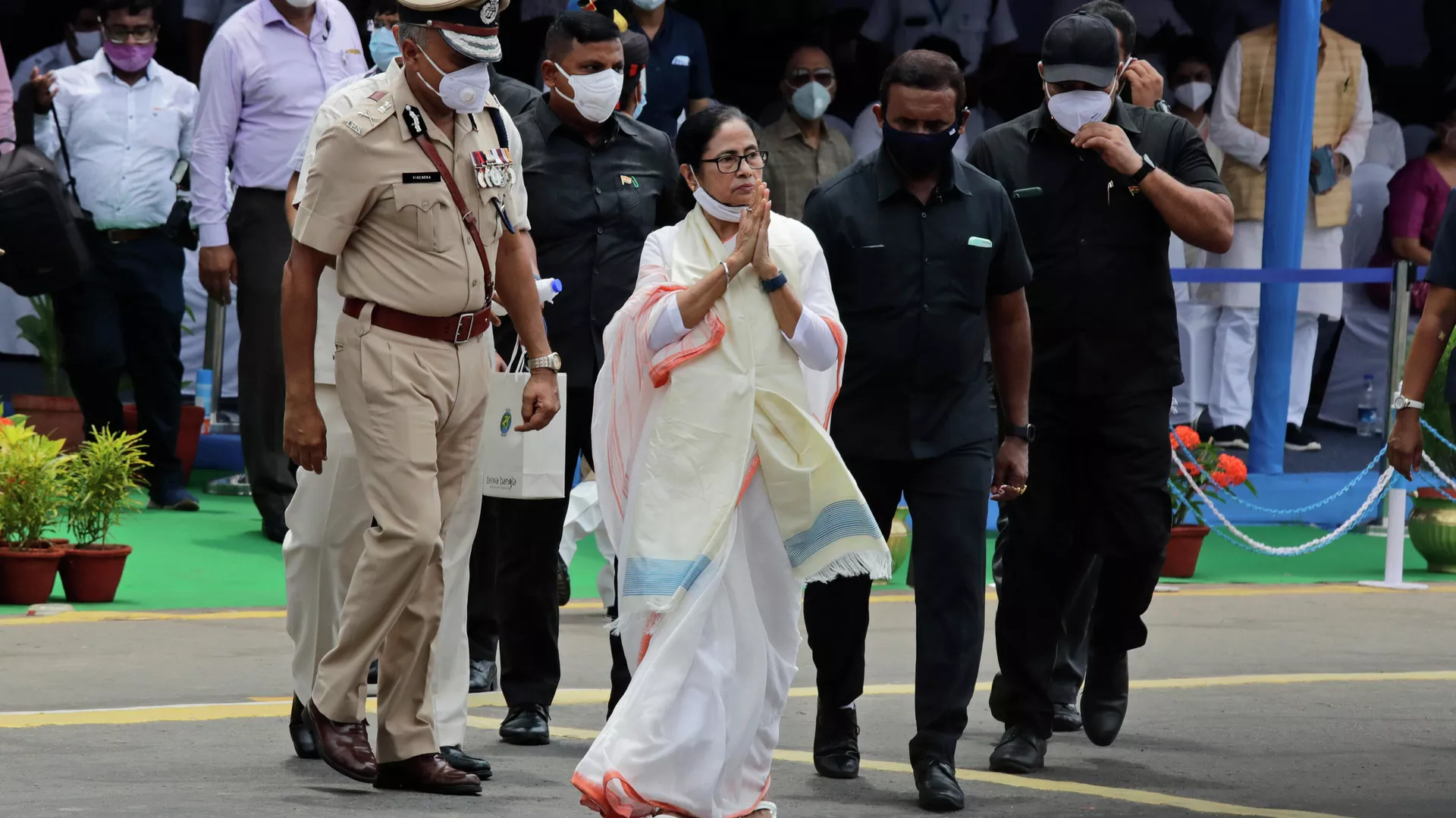 Mamata Banerjee, Chief Minister of West Bengal state, greets the audience during Independence Day parade in Kolkata, India, Sunday, Aug. 15, 2021. 