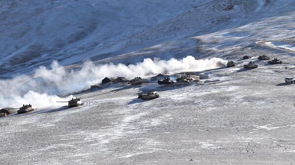 In this Feb. 10, 2021, file photo provided by the Indian Army, tanks pull back from the banks of Pangong Tso lake region, in Ladakh along the India-China border. - Sputnik India