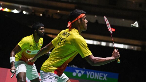 Chirag Shetty (R) and Satwiksairaj Rankireddy (L) of India play a shot against Aaron Chia and Soh Wooi Yik of Malaysia during their men's doubles semi-final match on day six of the Badminton World Championships in Tokyo on August 27, 2022. - Sputnik India