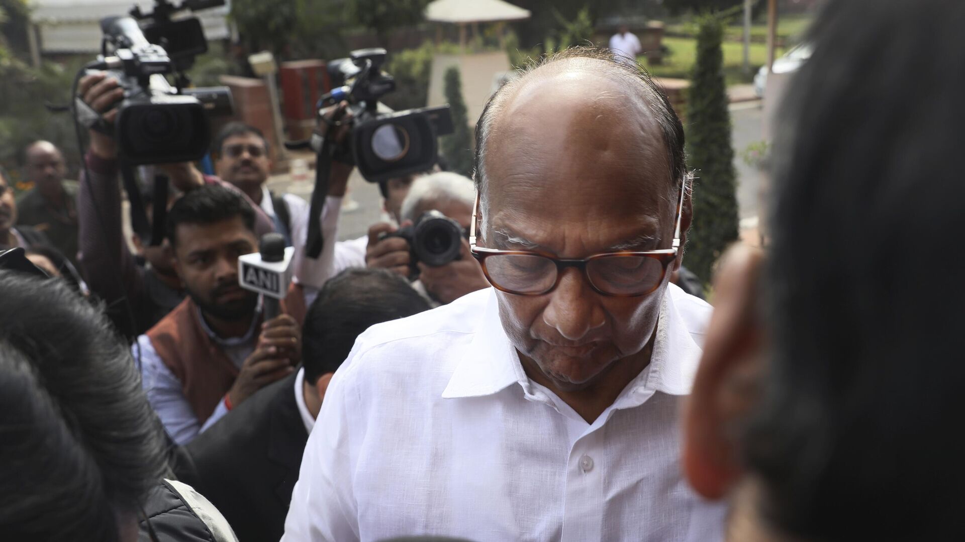 Media personnel surround Nationalist Congress Party leader Sharad Pawar as he arrives on the opening day of the winter session of the Parliament in New Delhi, India, Monday, Nov.18, 2019. - Sputnik India, 1920, 02.05.2023