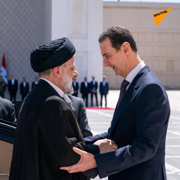 The first photos emerged online showing the meeting between Assad and Raisi with a delegation of ministers at the residence of the Syrian president in Damascus - Sputnik India