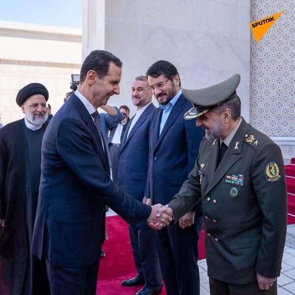 The first photos emerged online showing the meeting between Assad and Raisi with a delegation of ministers at the residence of the Syrian president in Damascus - Sputnik India