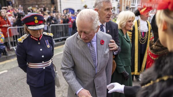 King Charles III reacts after an egg was thrown his direction as he arrived for a ceremony at Micklegate Bar in York - Sputnik भारत