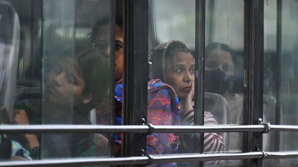 Women travel on a Delhi Transport Corporation bus in New Delhi - Sputnik भारत