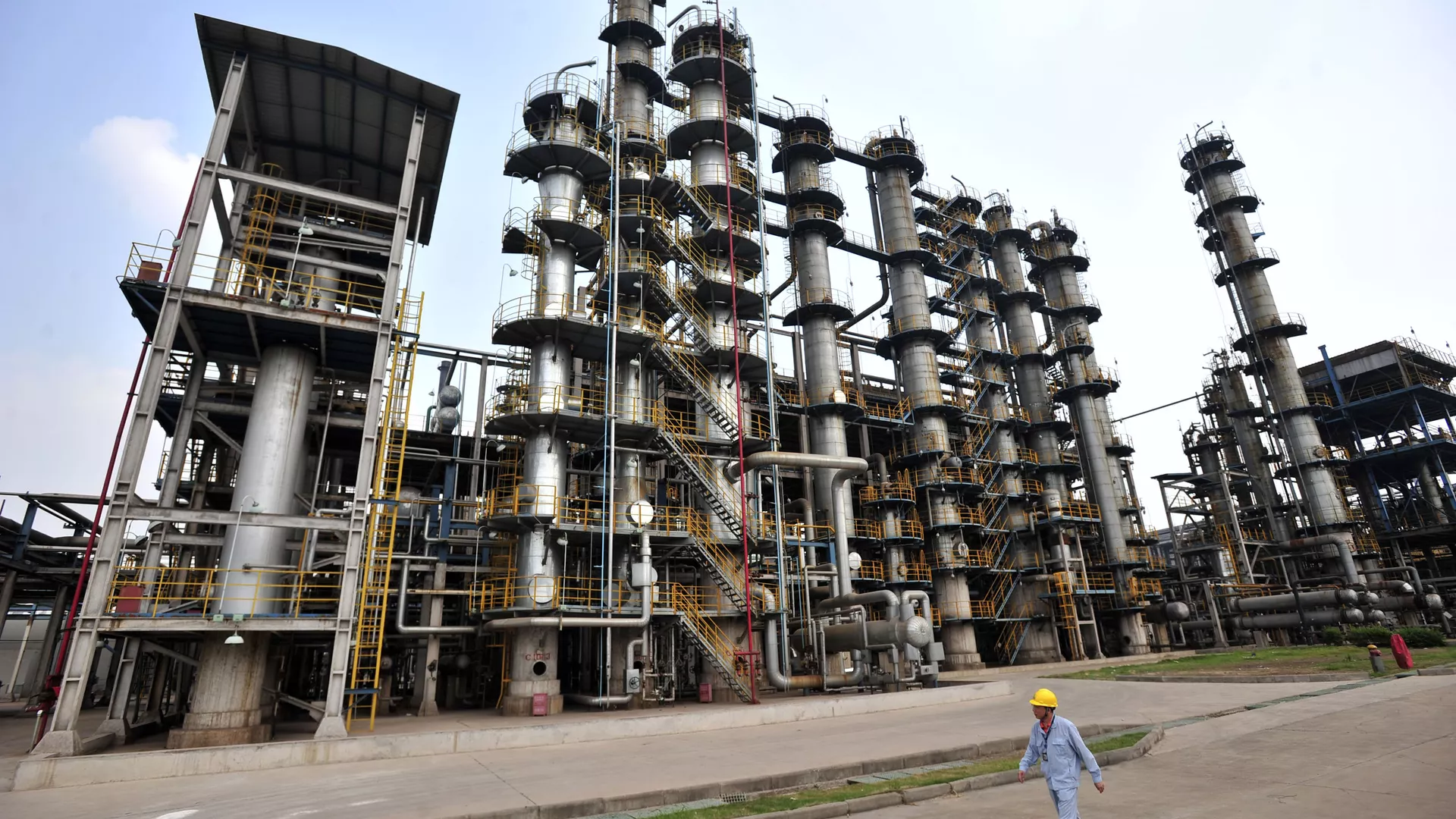 This photo taken on May 10, 2011 shows a worker walking by at an oil refinery of China's Sinopec, in Wuhan, central China's Hubei province