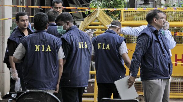 Officers of the National Investigation Agency collect evidence  - Sputnik India