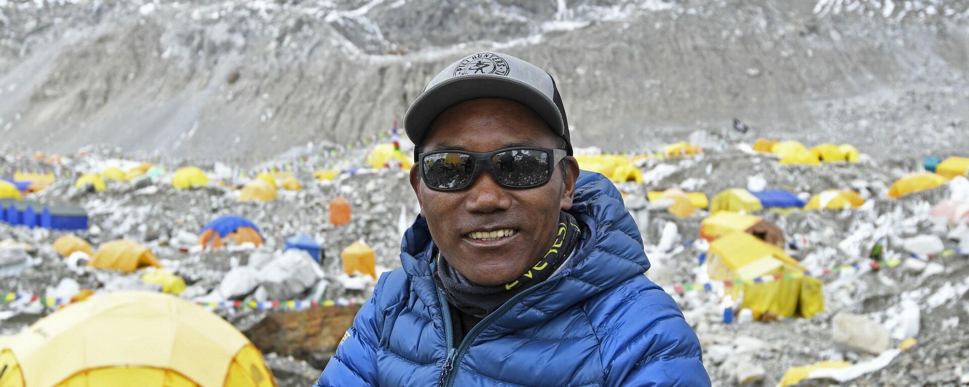 In this file photo taken on May 2, 2021, Nepal's mountaineer Kami Rita Sherpa poses for a picture during an interview with AFP at the Everest base camp in the Mount Everest region of Solukhumbu district. Kami Rita Sherpa reached the top of Mount Everest for the 27th time on May 17, reclaiming the record for the most summits of the world's highest mountain. - Sputnik India, 1920, 17.05.2023