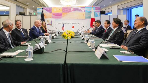 President Joe Biden, third left, reacts with Japan's Prime Minister Fumio Kishida, third right, at the start of a bilateral meeting in Hiroshima, Japan, Thursday, May 18, 2023, ahead of the start of the G-7 Summit. - Sputnik India