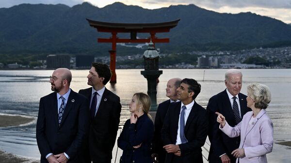 (L-R) President of the European Council Charles Michel, Canada's Prime Minister Justin Trudeau, Italy's Prime Minister Giorgia Meloni, Germany's Chancellor Olaf Scholz, Britain's Prime Minister Rishi Sunak, US President Joe Biden and European Commission President Ursula von der Leyen visit the Itsukushima Shrine on Miyajima Island in Hatsukaichi on May 19, 2023, during the G7 Leaders' Summit being held in Hiroshima. - Sputnik India
