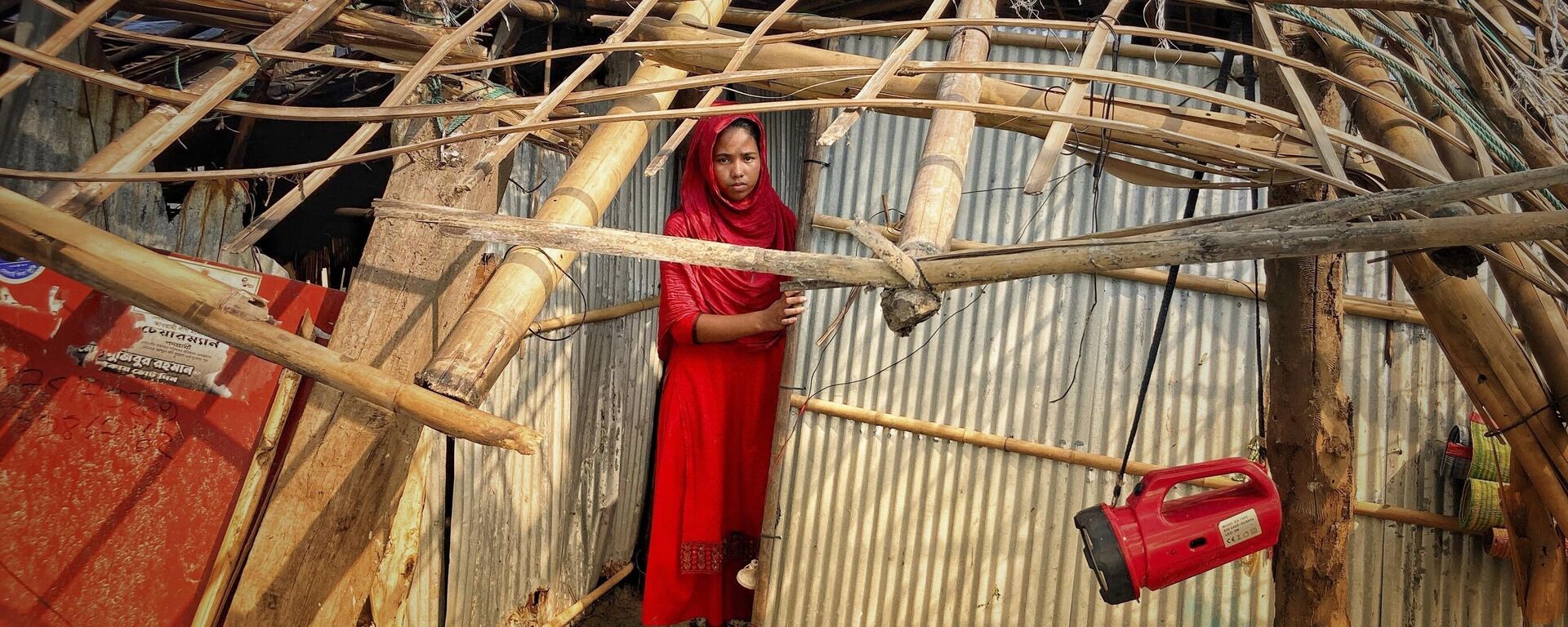 A woman surveys the damage caused to her home by Cyclone Mocha at Saint Martin island in Cox's Bazar, Bangladesh, Monday, May 15, 2023. - Sputnik India, 1920, 19.05.2023