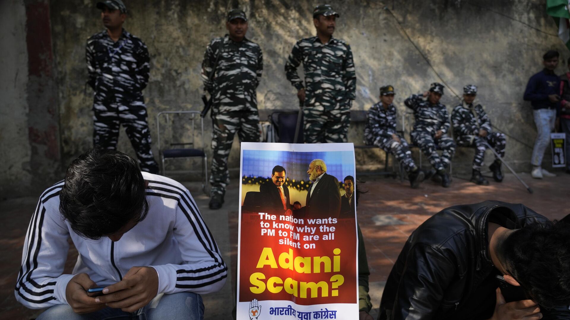 Members of opposition Congress party, demanding an investigation into allegations of fraud and stock manipulation by India's Adani Group display a placard with images of Indian businessman Gautam Adani and Indian Prime Minister Narendra Modi during a protest in New Delhi, India, Monday, Feb.6, 2023. - Sputnik India, 1920, 19.05.2023