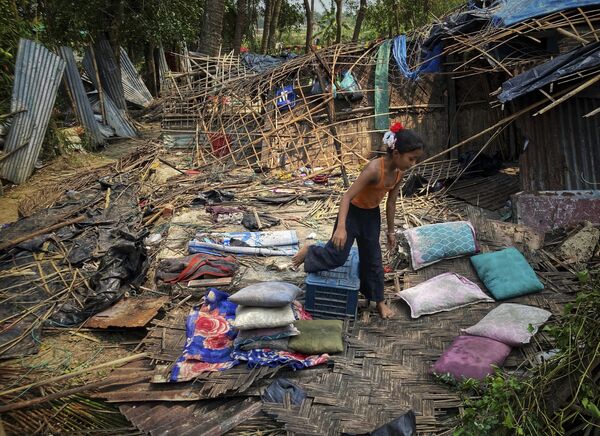 A child runs through the wreckage of her home damaged by Cyclone Mocha at Saint Martin island in Cox's Bazar, Bangladesh, Monday, May 15, 2023. - Sputnik India