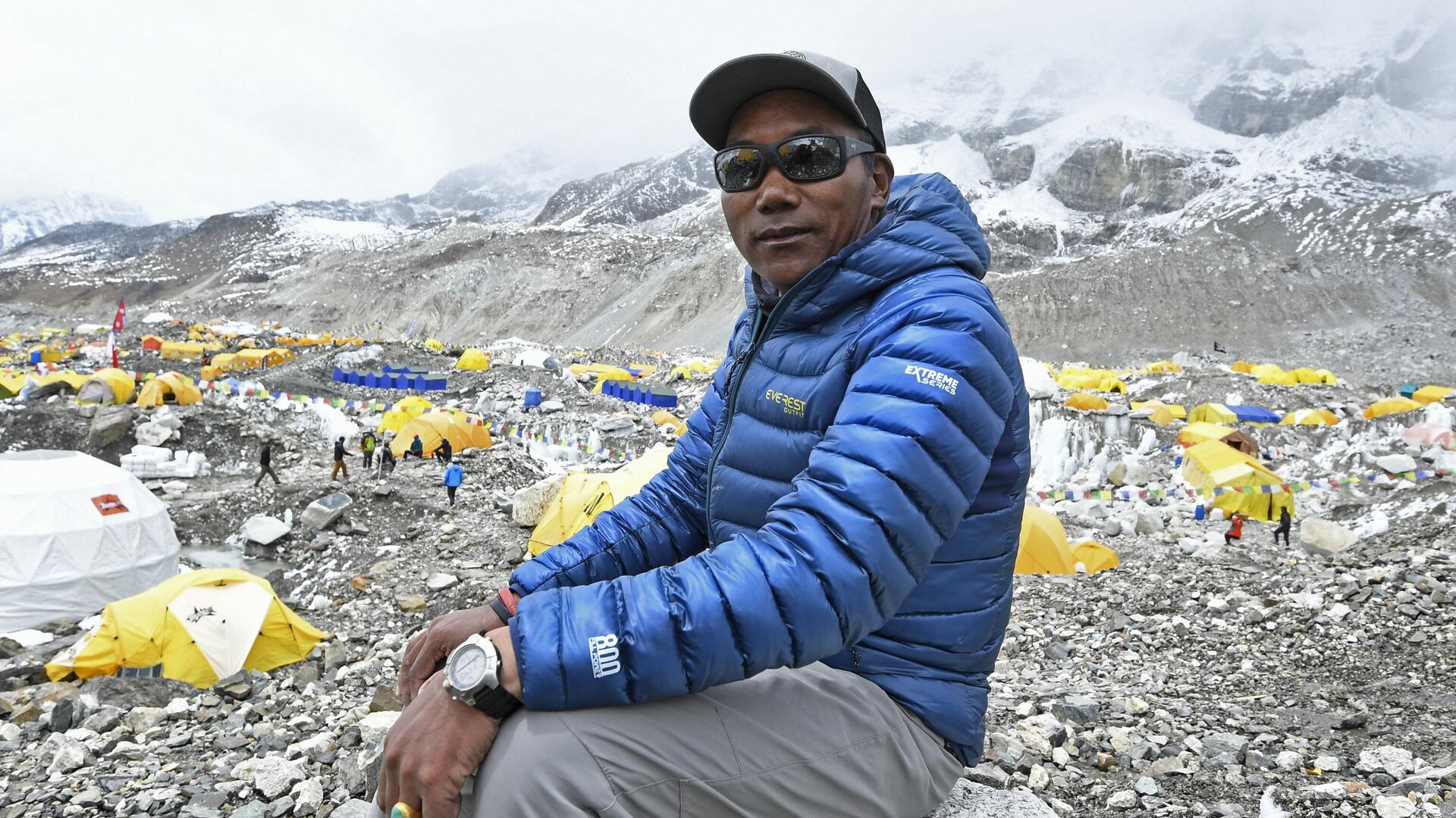 In this photograph taken on May 2, 2021, Nepal's mountaineer Kami Rita Sherpa poses for a picture during an interview with AFP at the Everest base camp in the Mount Everest region of Solukhumbu district, as Sherpa on May 7 reached the summit of Mount Everest for the 25th time, breaking his own record for most summits of the highest mountain in the world. - Sputnik India, 1920, 23.05.2023