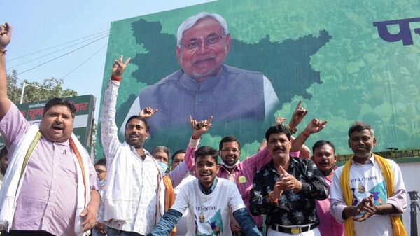Supporters of Janata Dal (United) celebrate the lead of their party alliance in initial results for the Bihar state assembly polls, in Patna, India, Tuesday, Nov. 10, 2020. - Sputnik India