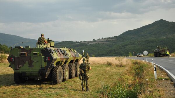 Serbian military and armored vehicles near the road between the village of Raska and the Jarinje checkpoint on the administrative line between central Serbia and northern Kosovo and Metohija. - Sputnik India