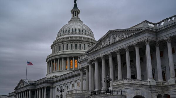 The Senate side of the Capitol is seen in Washington, early Thursday, Dec. 22, 2022, as lawmakers rush to complete passage of a bill to fund the government before a midnight Friday deadline, at the Capitol in Washington, Thursday, Dec. 22, 2022. - Sputnik India