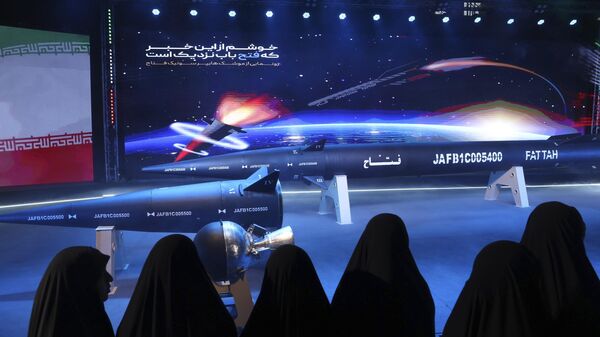 Women look at Fattah missile in a ceremony in Tehran, Iran, Tuesday, June 6, 2023. - Sputnik India