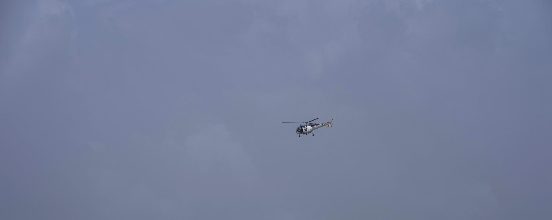 An Indian Coast Guard helicopter flies during high tide at the Juhu beach on the Arabian Sea cost in Mumbai, India, Tuesday, June 13, 2023. - Sputnik India, 1920, 13.06.2023