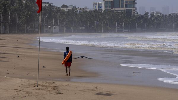 A lifeguard patrols during high tide at a deserted Juhu beach on the Arabian Sea cost in Mumbai, India, Tuesday, June 13, 2023. - Sputnik भारत