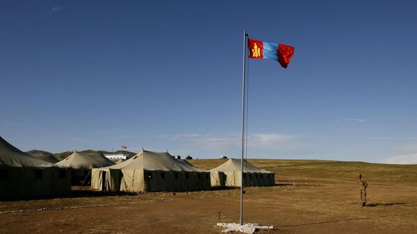 A Mongolian soldier stands guard next to a Mongolia national flag at a multinational peacekeeping training exercises in Tavan Tolgoi, about 70 kilometers (44 miles) southwest from Ulan Bator, Mongolia Sunday, Aug. 20, 2006. - Sputnik India
