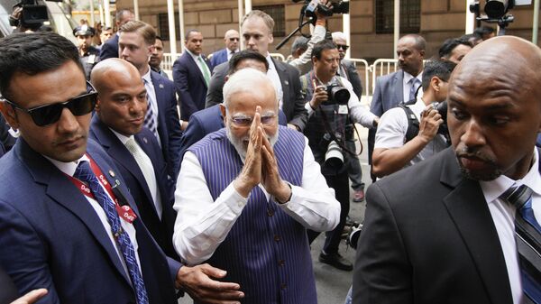 Indian Prime Minister Narendra Modi greets supporters as he arrives in New York on Tuesday, June 20, 2023. - Sputnik India