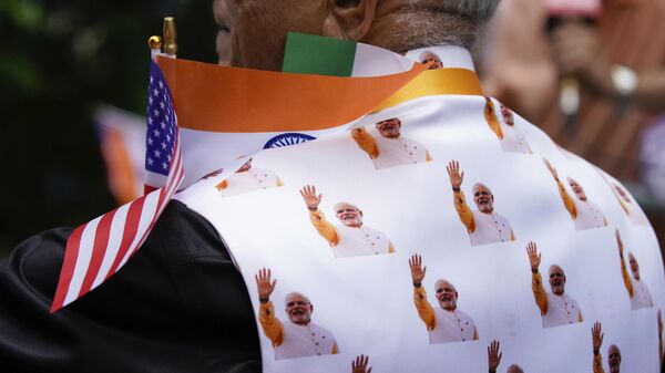 A supporter waits the arrival of Indian Prime Minister Narendra Modi at the Lotte hotel on Tuesday, June 20, 2023, in New York. Modi, known for his reputation of an ascetic, is participating in a yoga session at the U.N. during his three-day visit to the United States. - Sputnik India