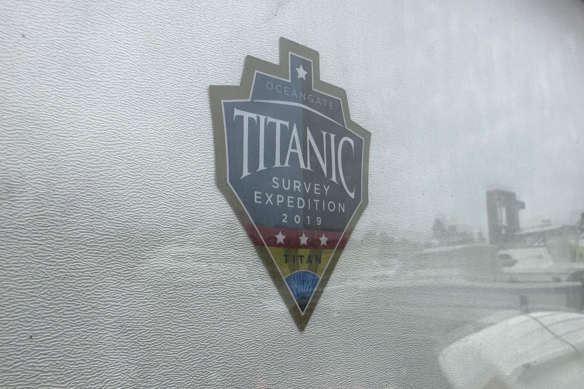The logo for an OceanGate Expeditions 2019 Titanic expedition is seen on a marine industrial warehouse office door in Everett, Wash., Tuesday, June 20, 2023. - Sputnik India, 1920, 23.06.2023