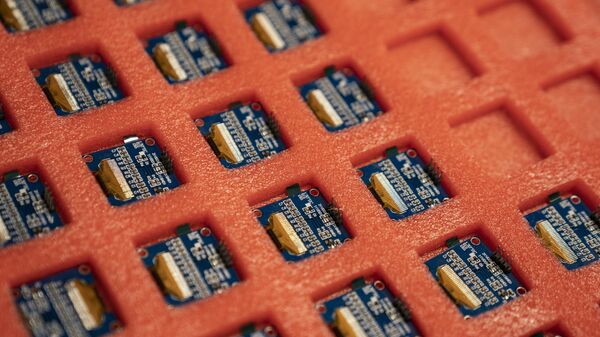 Semi-conductor chips are assembled and organized on a workbench before a ribbon-cutting ceremony to mark the opening of a Nanotronics manufacturing center at the Brooklyn Navy Yard, Wednesday, April 28, 2021, in the Brooklyn borough of New York. - Sputnik India