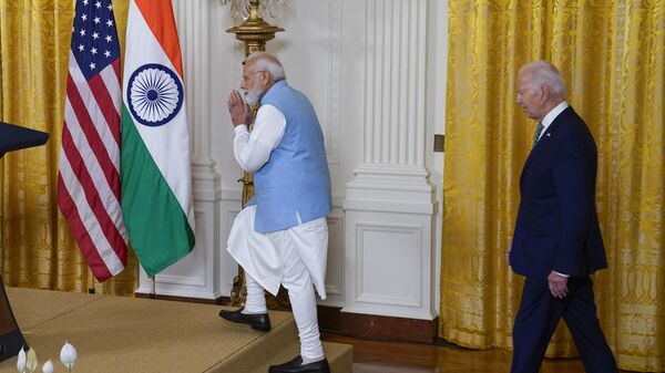 India's Prime Minister Narendra Modi and President Joe Biden arrive for a news conference in the East Room of the White House, Thursday, June 22, 2023, in Washington. - Sputnik India