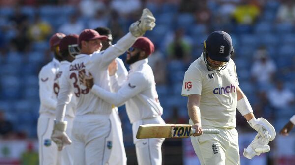 Jonny Bairstow (R) of England walks off the field dismissed by Alzarri Joseph of West Indies during the 3rd day of the 3rd and final Test between West Indies and England - Sputnik India