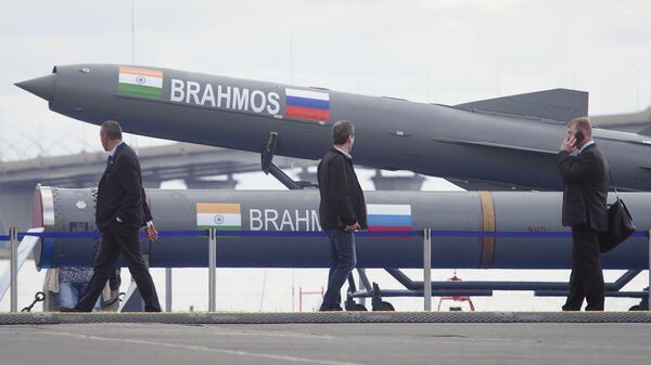 Visitors walk past an Indian Brahmos anti-ship missile at the International Maritime Defence show in St.Petersburg, Russia, Thursday, July 11, 2019 - Sputnik भारत