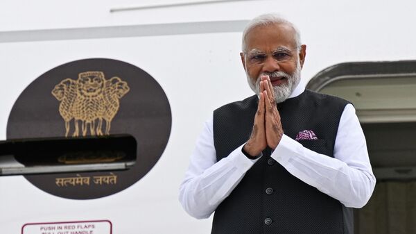 India's Prime Minister Narendra Modi joins his hands as he lands as he lands at the Orly airport in Orly, south of Paris - Sputnik India
