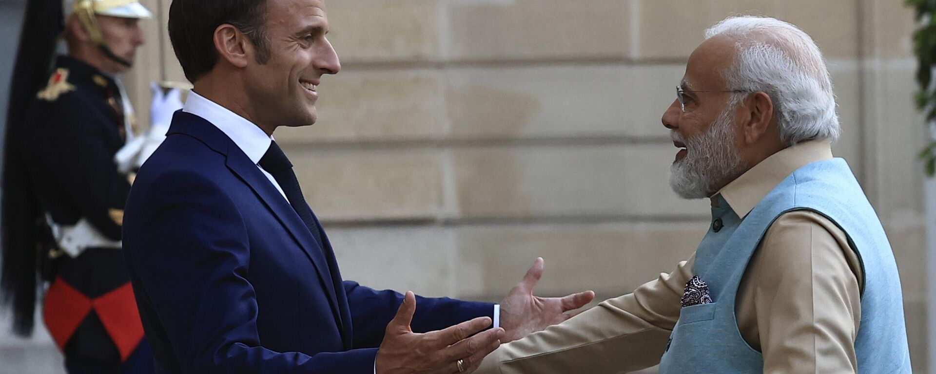 French President Emmanuel Macron welcomes Indian Prime Minister Narendra Modi before a working dinner, Thursday, July 13, 2023 at the Elysee Palace, in Paris. - Sputnik India, 1920, 14.07.2023