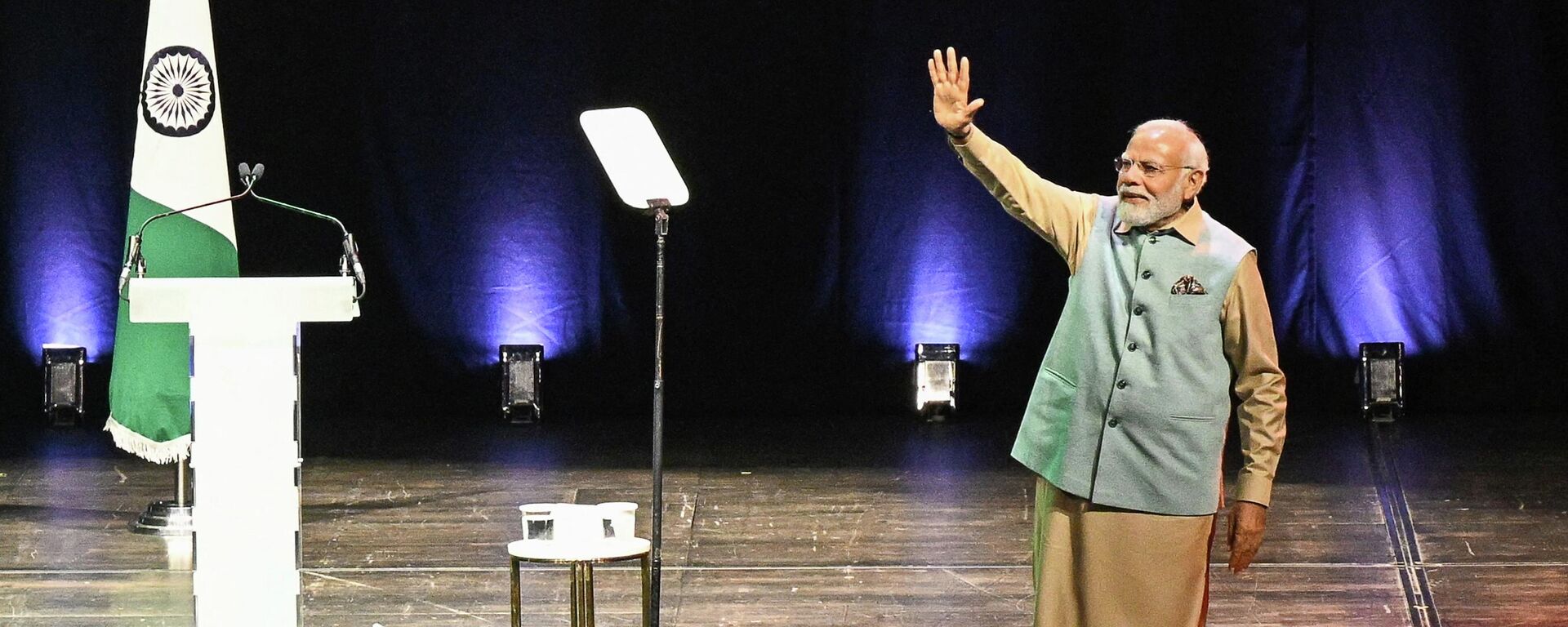 Indian Prime Minister Narendra Modi waves on stage as he delivers a speech at the Seine Musicale in Boulogne-Billancourt, Paris suburb on July 13, 2023. - Sputnik India, 1920, 14.07.2023