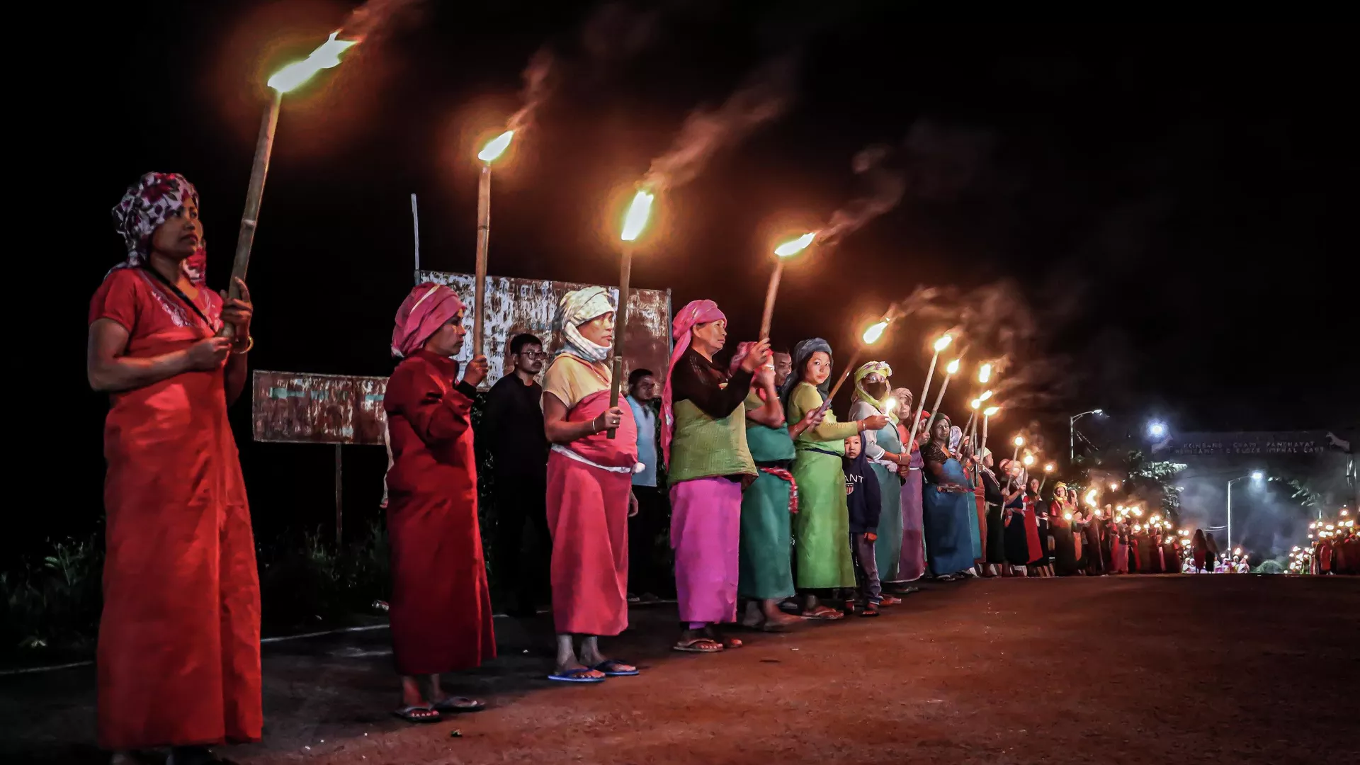 In this picture taken on July 10, 2023, women belonging to the 'Meira Paibis', a group of women representing Meitei society, hold torches during a demonstation demanding for the restoration of peace in India's north-eastern Manipur state in Imphal, following ongoing ethnic violence in Manipur. 