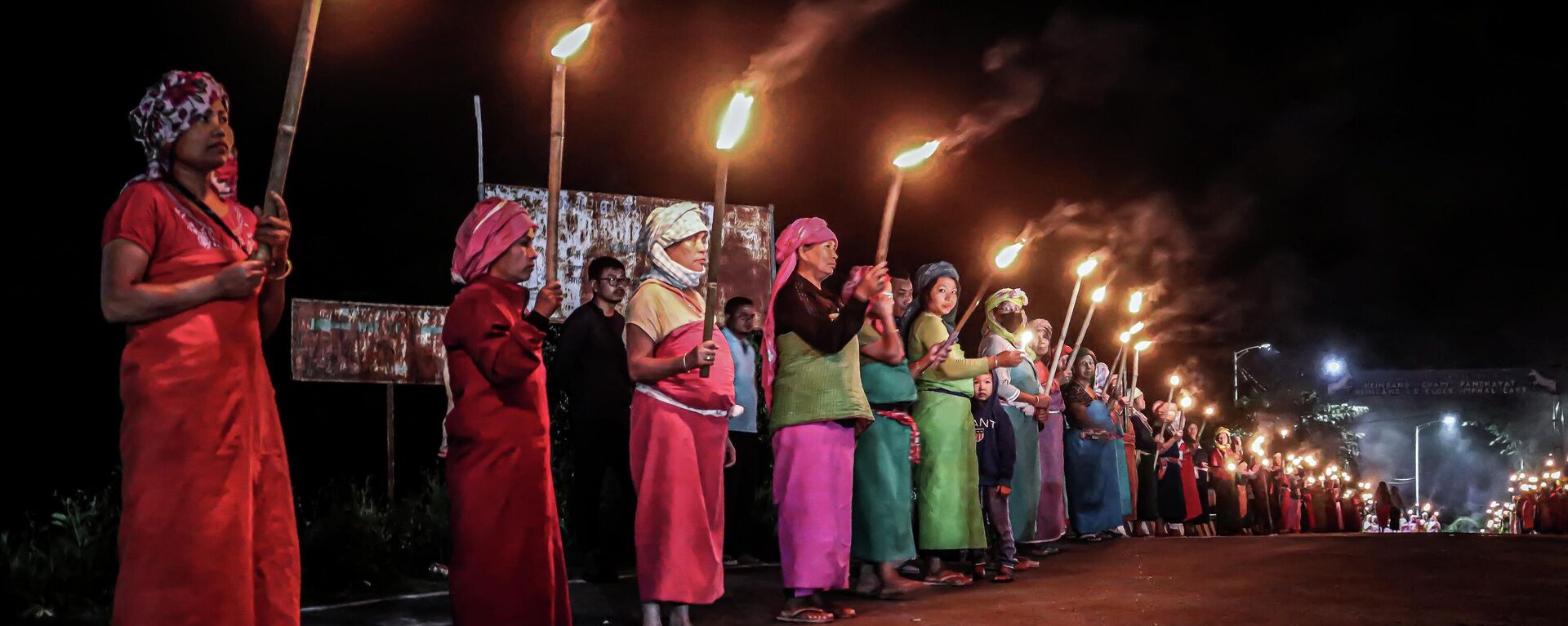 In this picture taken on July 10, 2023, women belonging to the 'Meira Paibis', a group of women representing Meitei society, hold torches during a demonstation demanding for the restoration of peace in India's north-eastern Manipur state in Imphal, following ongoing ethnic violence in Manipur.  - Sputnik India, 1920, 25.07.2023