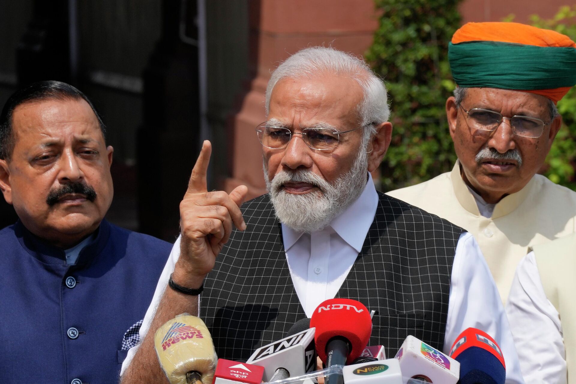 Indian Prime Minister Narendra Modi speaks as he arrives on the opening day of the monsoon session of the Indian parliament - Sputnik India, 1920, 20.07.2023