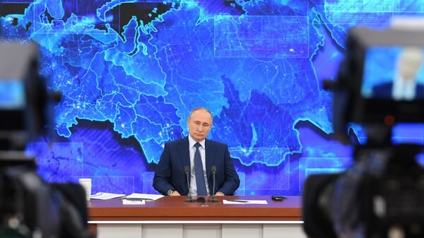 Russian President Vladimir Putin speaks during his annual end-of-year news conference, held online in a video conference mode, at the Novo-Ogaryovo state residence outside Moscow, Russia - Sputnik India