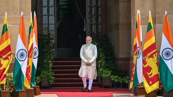 India's Prime Minister Narendra Modi waits for the arrival of Sri Lanka's President Ranil Wickremesinghe, before a meeting at Hyderabad House in New Delhi on July 21, 2023.  - Sputnik भारत