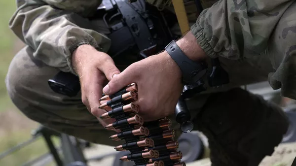 Russian servicemen of a volunteer unit of Central Military District load ammunition into a BMP-3 infantry fighting vehicle during a combat training in the course of Russia's military operation in Ukraine - Sputnik India